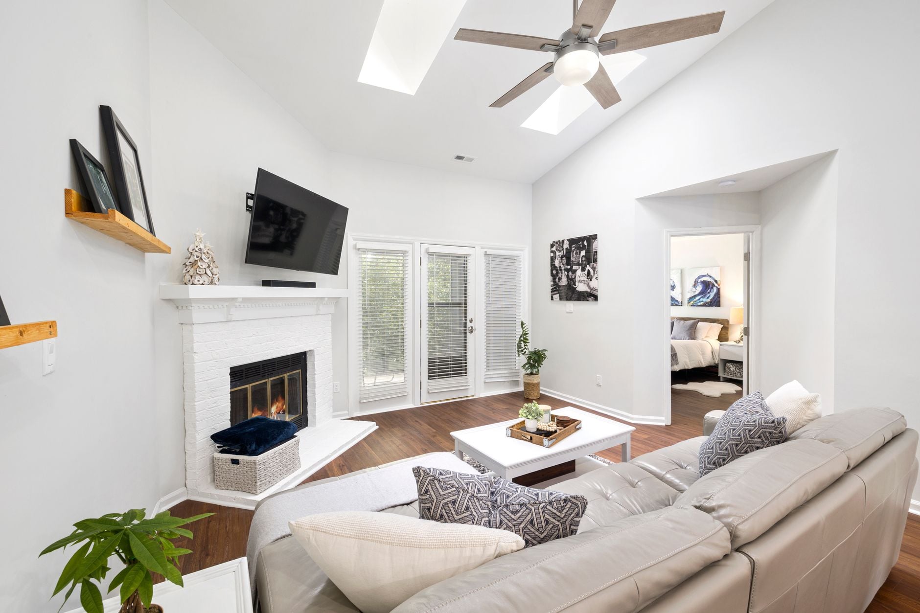 Bright and contemporary living room with a fireplace and stylish decor.